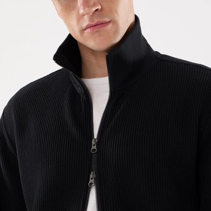 The model is wearing this New Era Black Label Jacket in black. 4