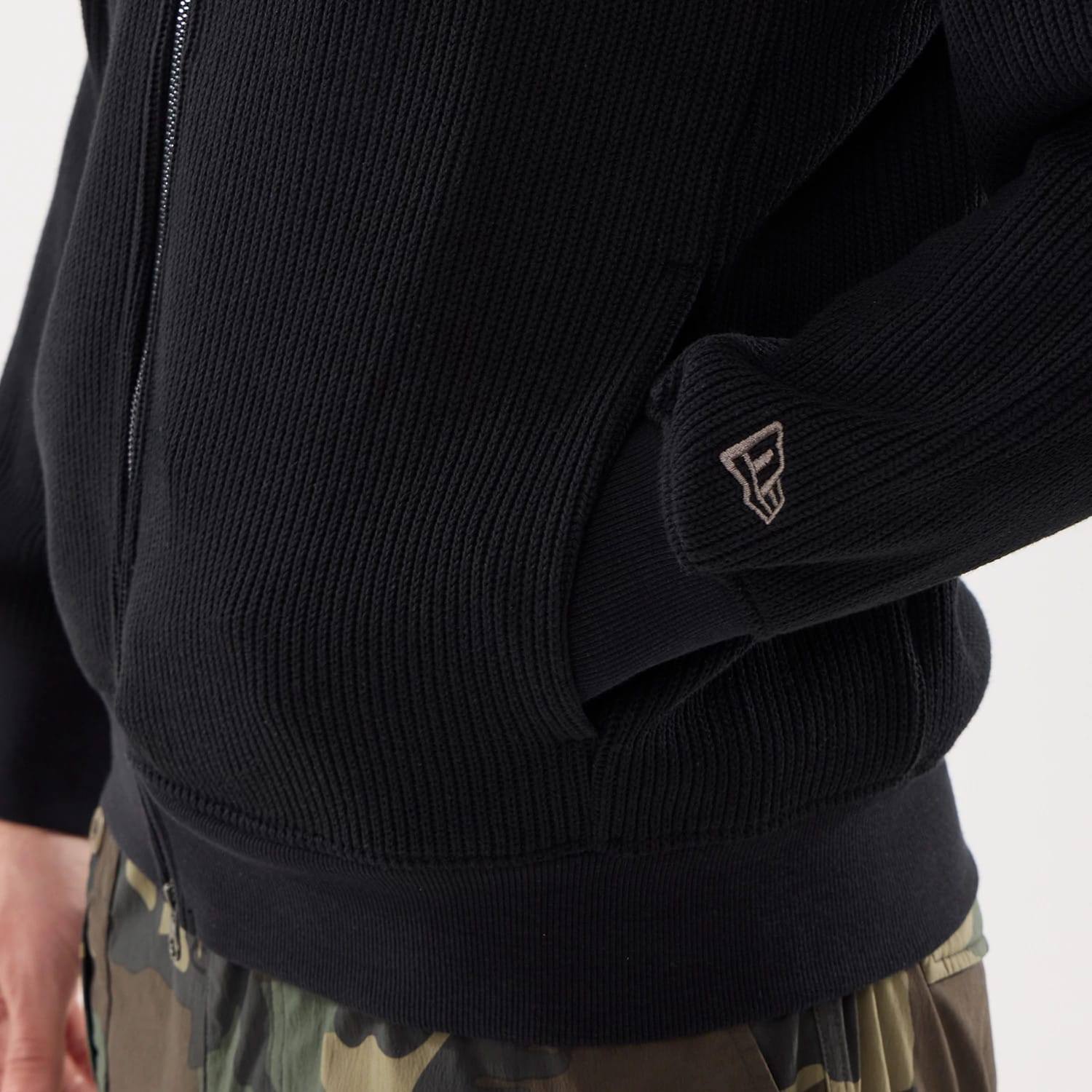 The model is wearing this New Era Black Label Jacket in black. 5