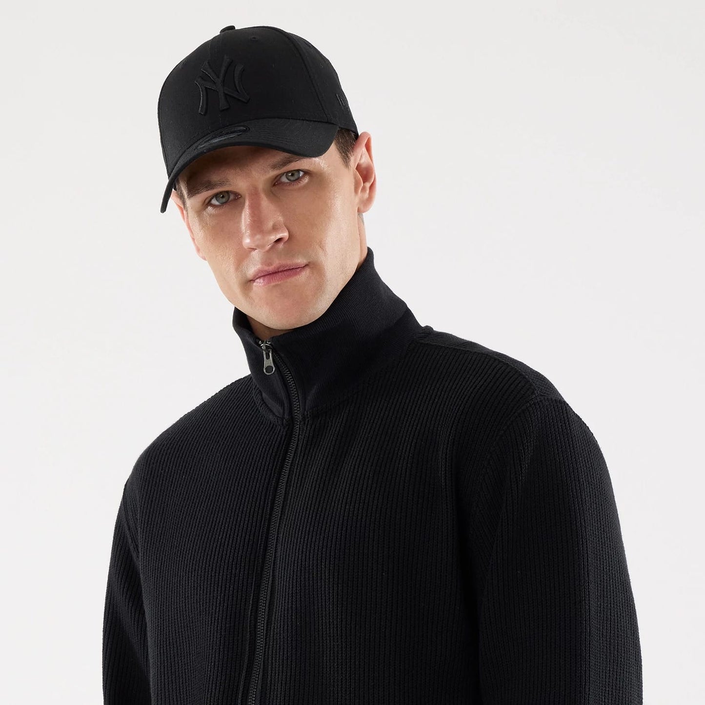 The model is wearing this New Era Black Label Jacket in black. 6