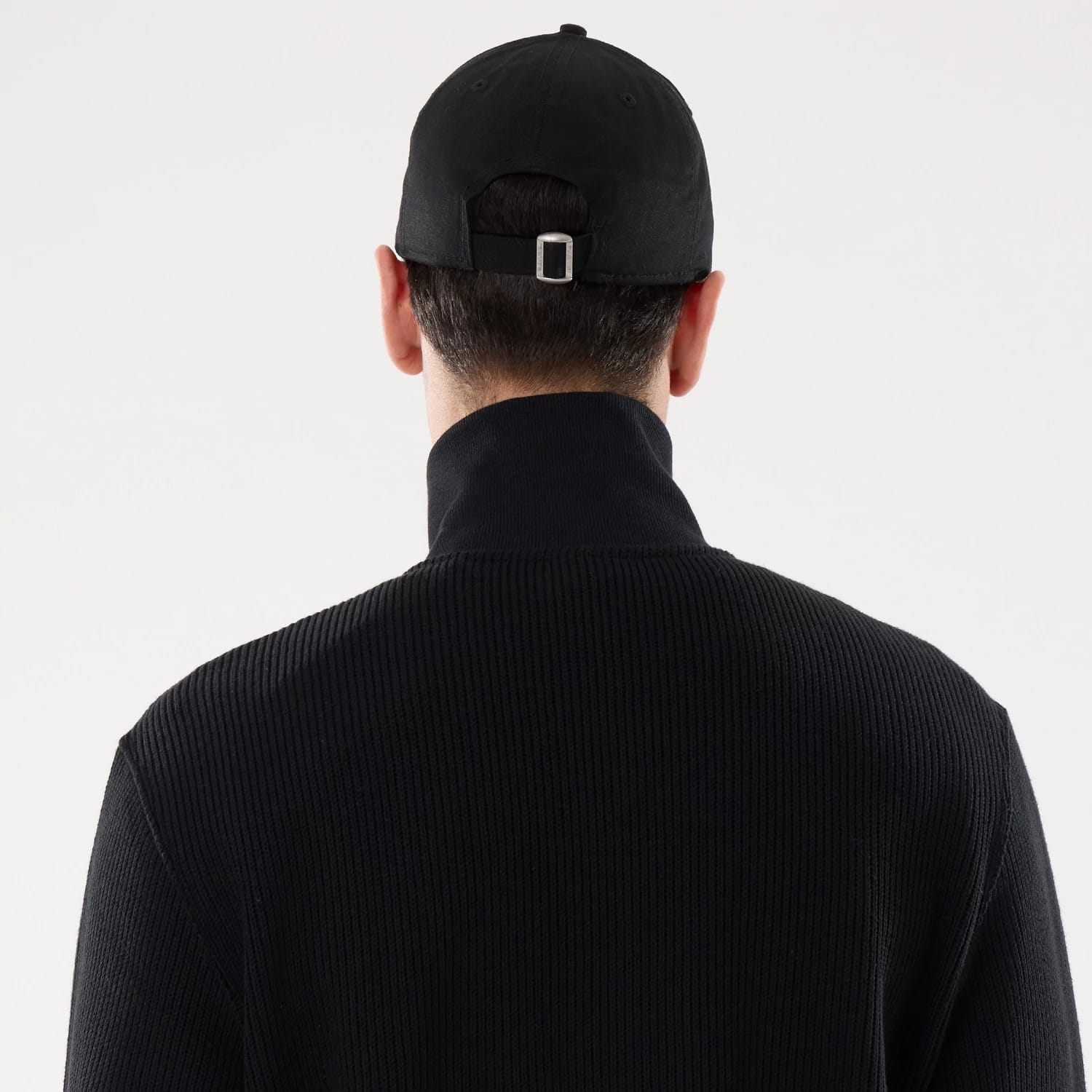 The model is wearing this New Era Black Label Jacket in black. 7