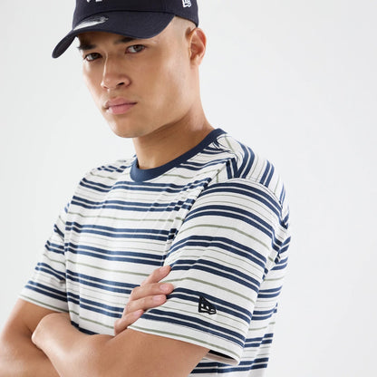 The model is wearing this New Era Boarder Stripe T-Shirt in white. 6