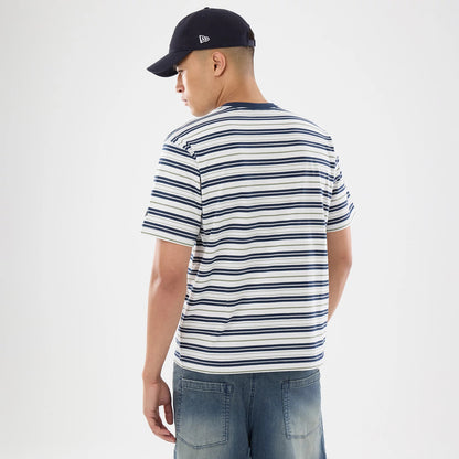 The model is wearing this New Era Boarder Stripe T-Shirt in white. 2