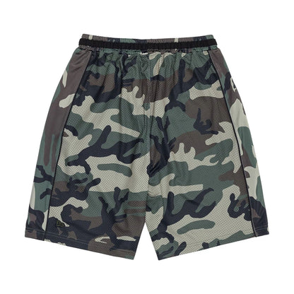 The model is wearing this New Era Bermuda Oversized Shorts in 6 Day Camo. 2