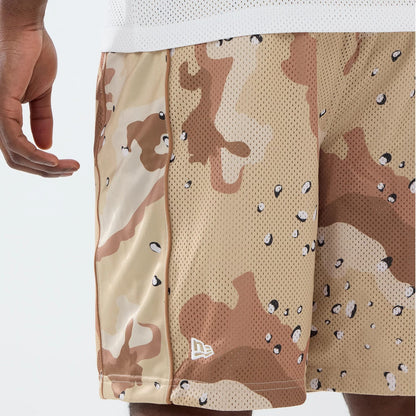 The model is wearing this New Era Bermuda Oversized Shorts in Woodland Camo. 3