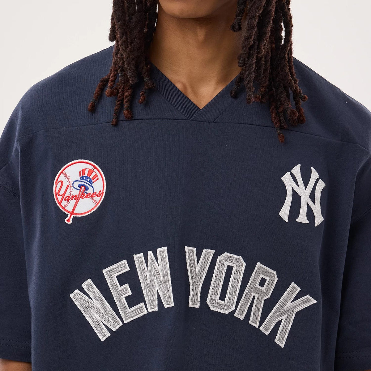 The model is wearing this MLB Fan Family New York Yankees Jersey in navy. 4