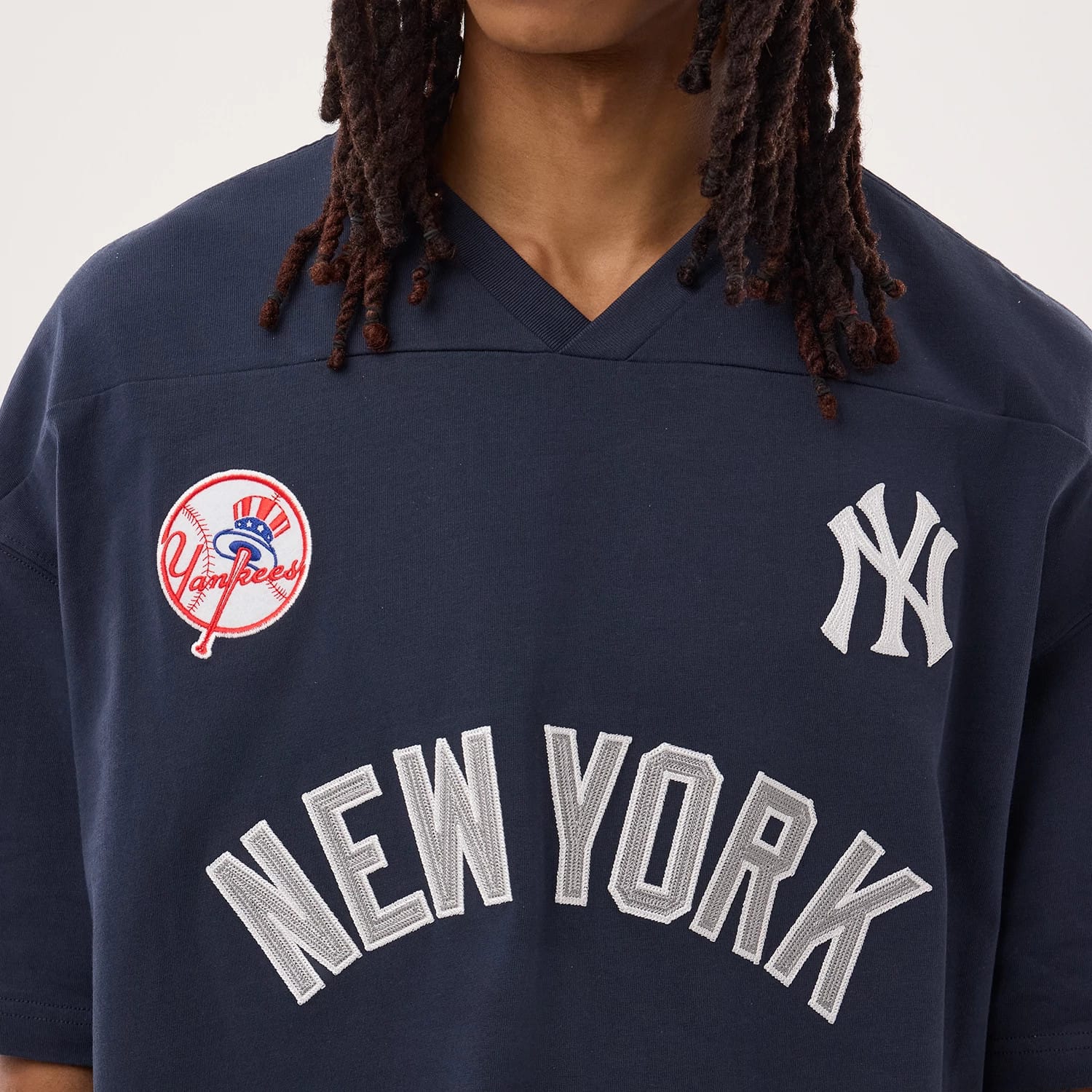 The model is wearing this MLB Fan Family New York Yankees Jersey in navy. 4