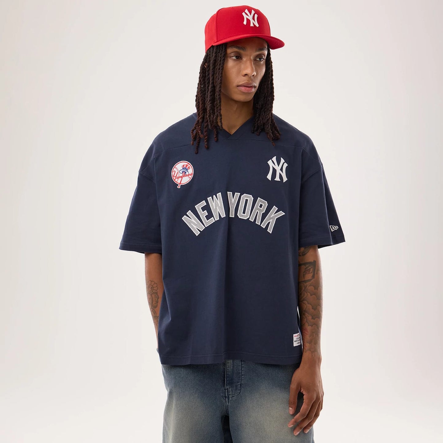 The model is wearing this MLB Fan Family New York Yankees Jersey in navy. 1