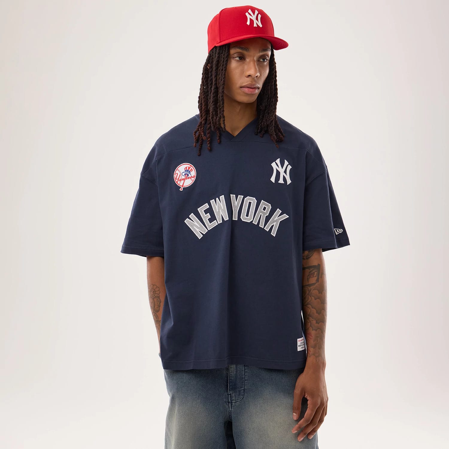 The model is wearing this MLB Fan Family New York Yankees Jersey in navy. 1