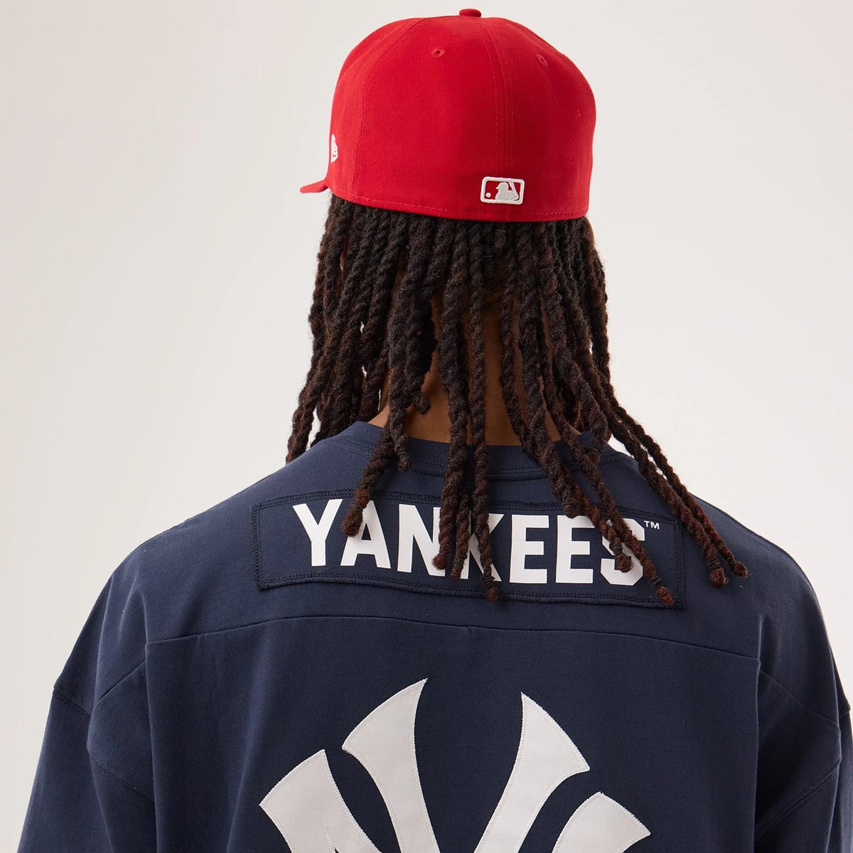 The model is wearing this MLB Fan Family New York Yankees Jersey in navy. 6