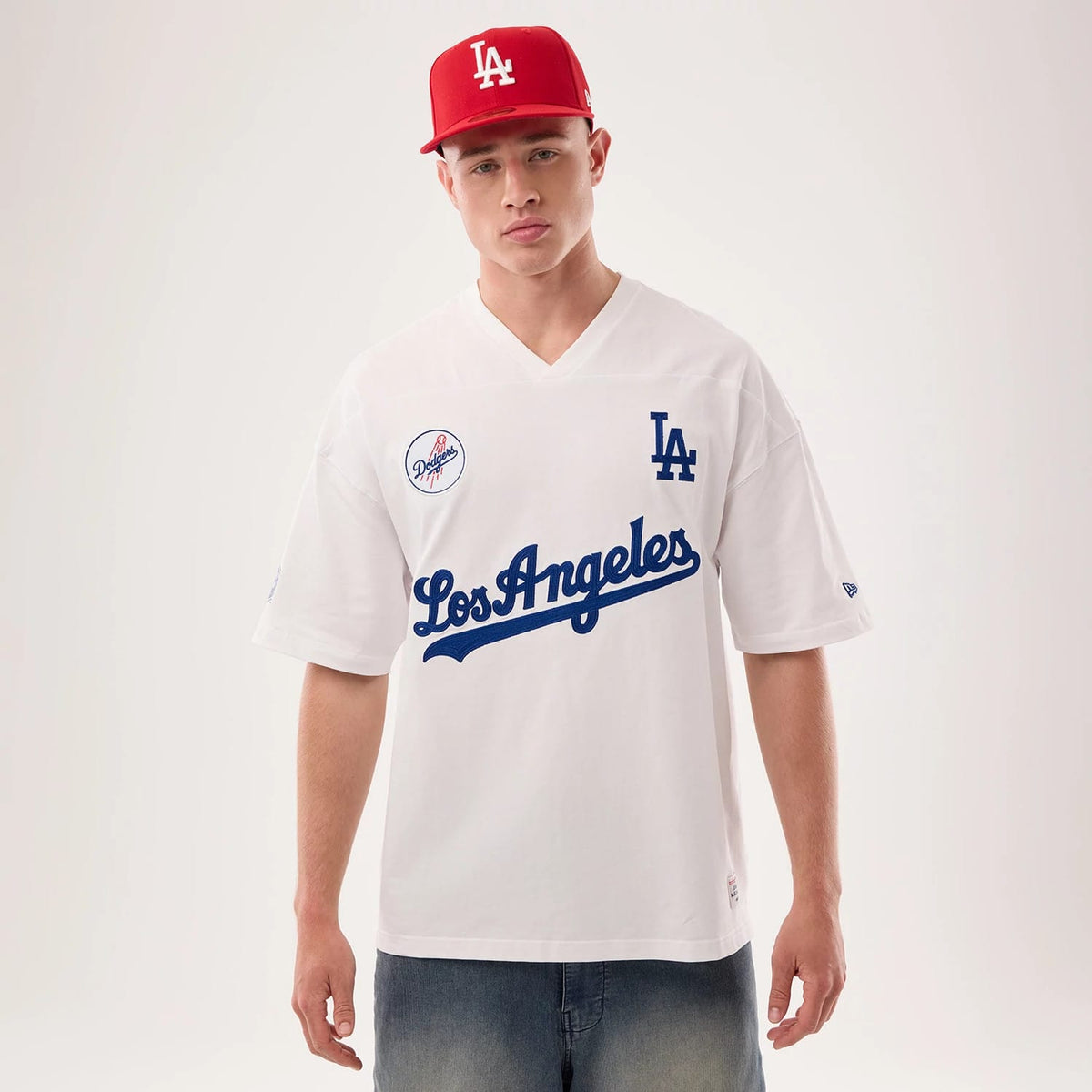 The model is wearing this MLB Fan Family Los Angeles Dodgers Jersey in white. 1