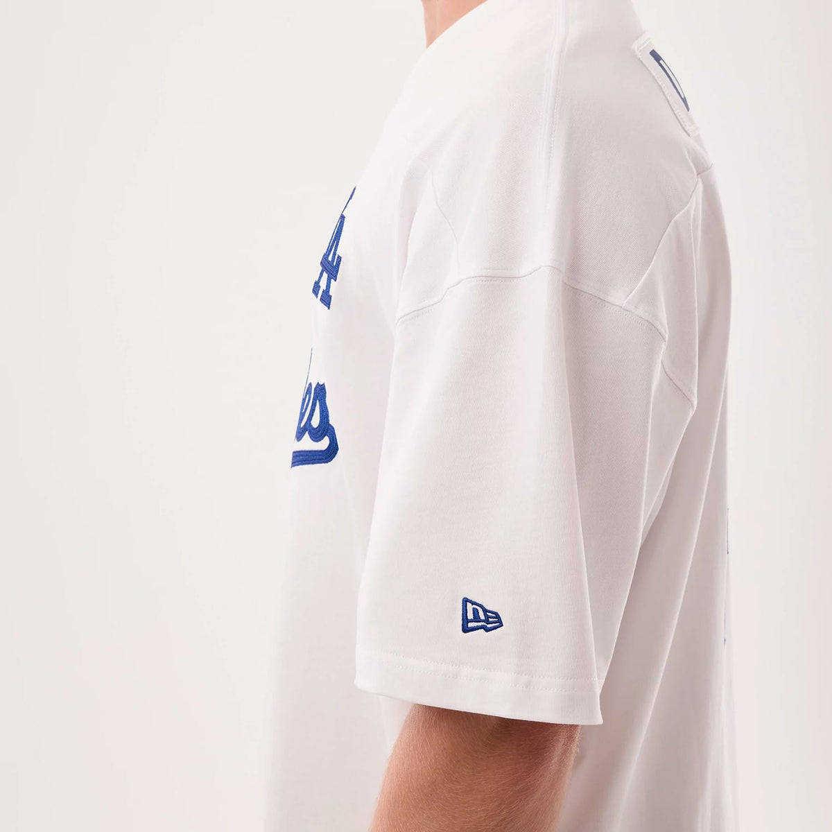 The model is wearing this MLB Fan Family Los Angeles Dodgers Jersey in white. 5