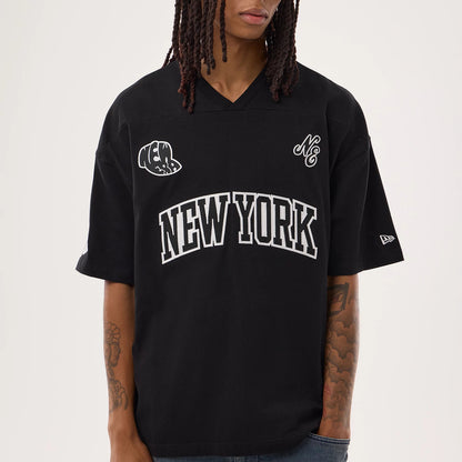 New Era Fan Family Black Jersey, front view on a model showing New York text in white across the chest, embroidered team logos on the sleeves and chest, with casual styling and a v-neckline.