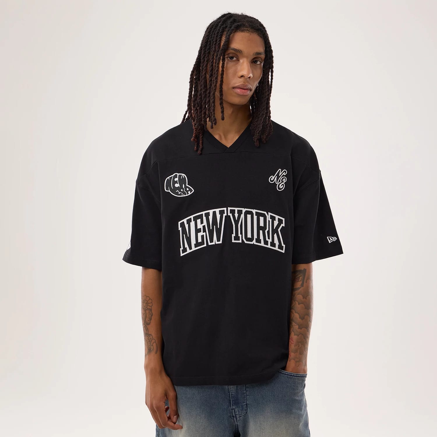 The model is wearing this New Era Fan Family Jersey in black. 1