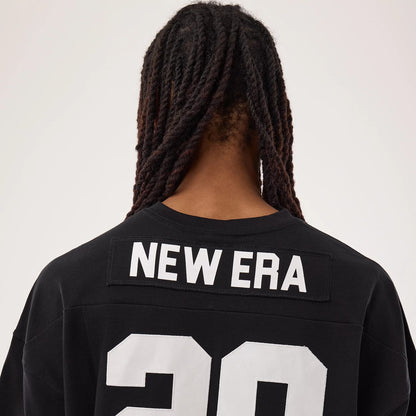 The model is wearing this New Era Fan Family Jersey in black. 7