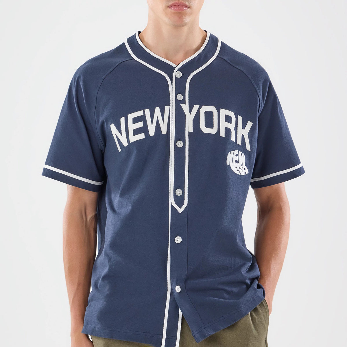 The model is wearing this New Era New York Jersey in navy. 3