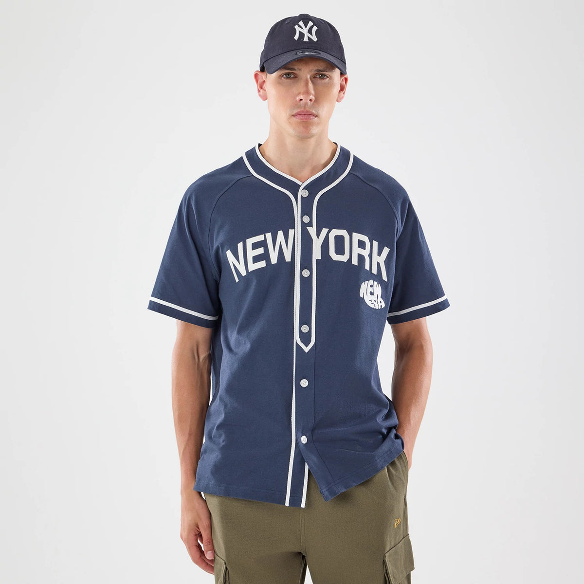 The model is wearing this New Era New York Jersey in navy. 1
