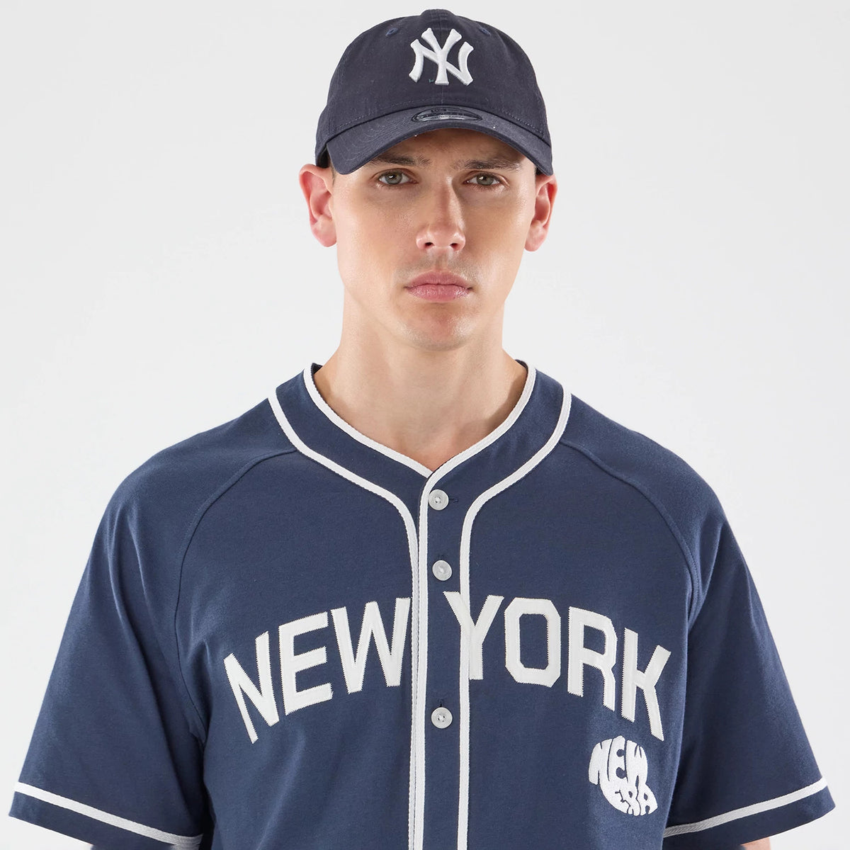 The model is wearing this New Era New York Jersey in navy. 5