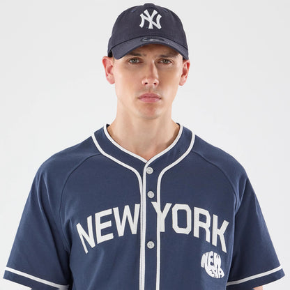 The model is wearing this New Era New York Jersey in navy. 5