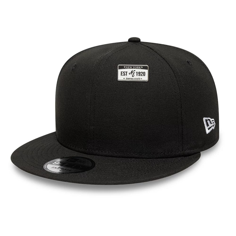 Pictured is this New Era License Plate Pinbadge in silver. 2