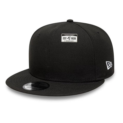 Pictured is this New Era License Plate Pinbadge in silver. 2