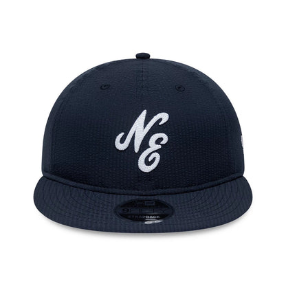 Pictured is this New Era Seersucker Retro Crown 9FIFTY cap in navy. 2
