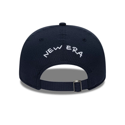 Pictured is this New Era Seersucker Retro Crown 9FIFTY cap in navy. 4