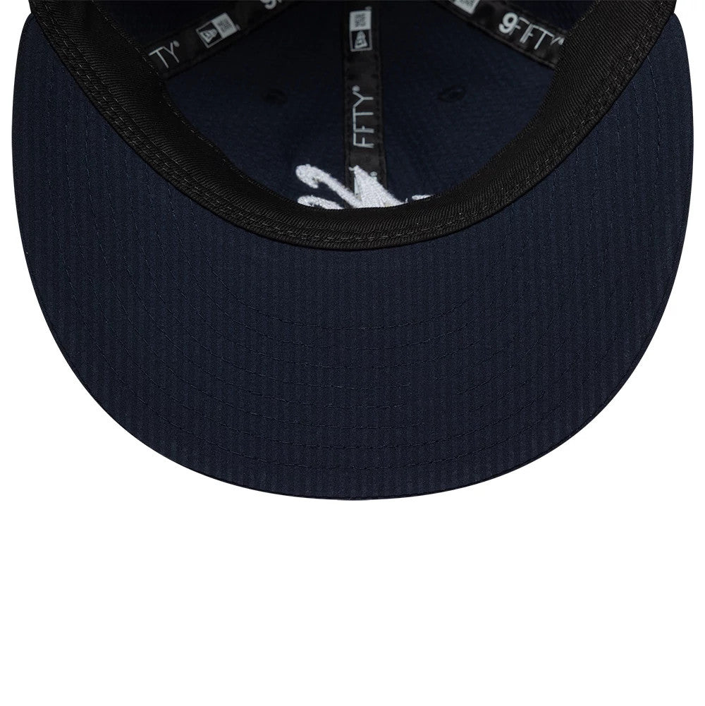 Pictured is this New Era Seersucker Retro Crown 9FIFTY cap in navy. 7