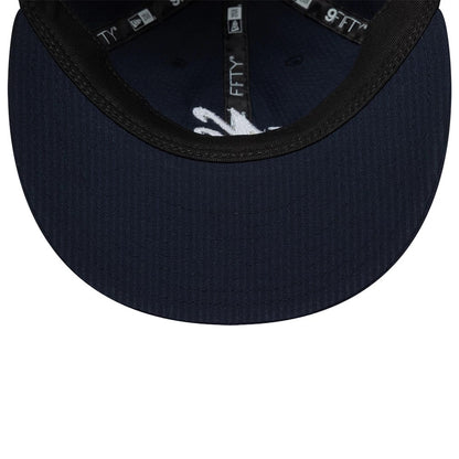 Pictured is this New Era Seersucker Retro Crown 9FIFTY cap in navy. 7