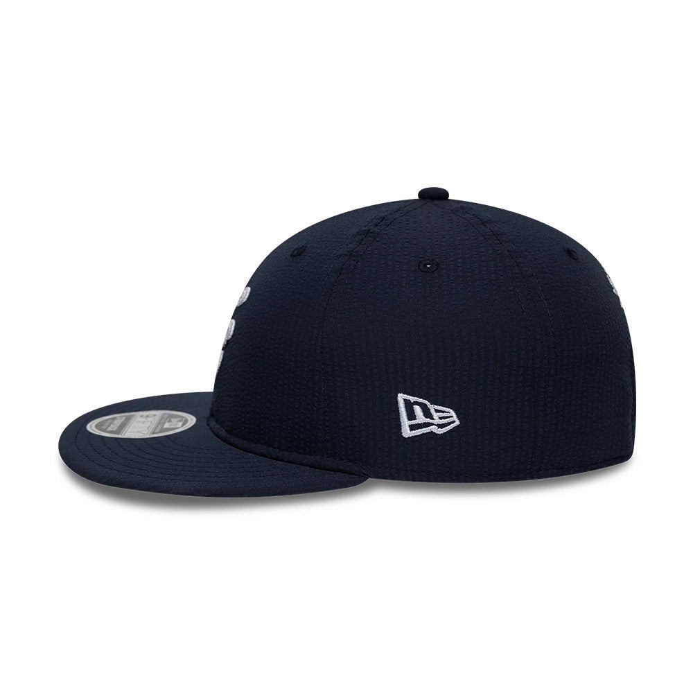 Pictured is this New Era Seersucker Retro Crown 9FIFTY cap in navy. 5