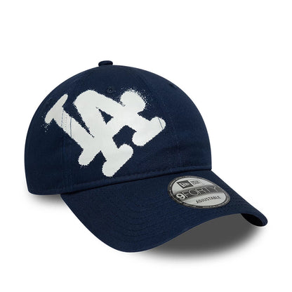 Pictured is this MLB Spray Paint LA Dodgers 9FORTY cap in dark blue. 1