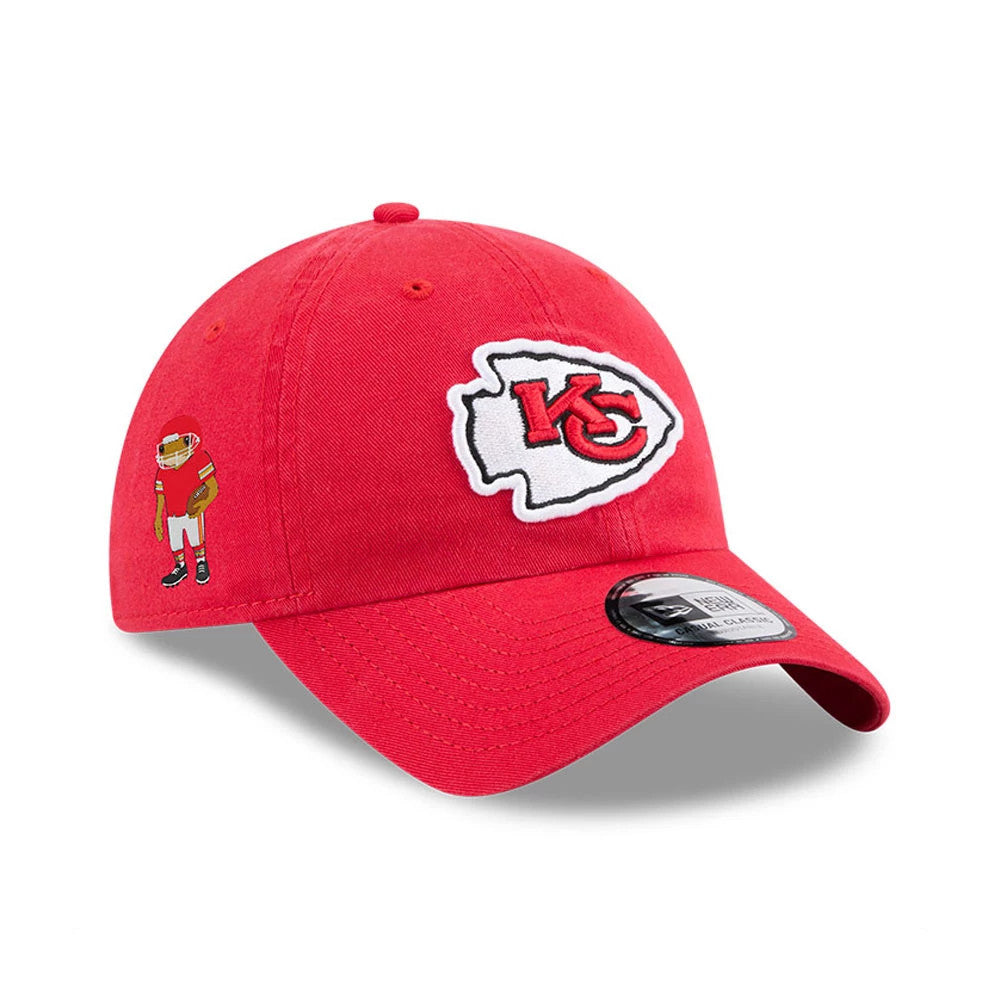 Kansas City Chiefs NFL X Bad Bunny Red Casual Classic Adjustable Cap, three-quarter view showing the red structured crown with the Kansas City logo on the front panel, a black and white side character logo, and a curved visor with a 9TWENTY size sticker.
