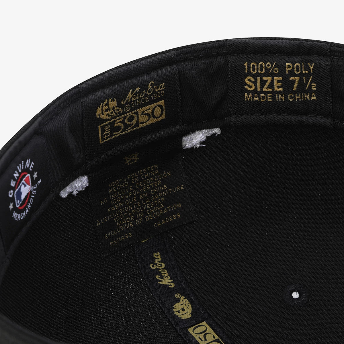 New York Yankees MLB 59FIFTY Day Black New Era 59FIFTY Fitted Cap, inside view showing black sweatband with gold size label and branding, MLB Genuine Merchandise patch on the left, and visible stitching on the structured crown.