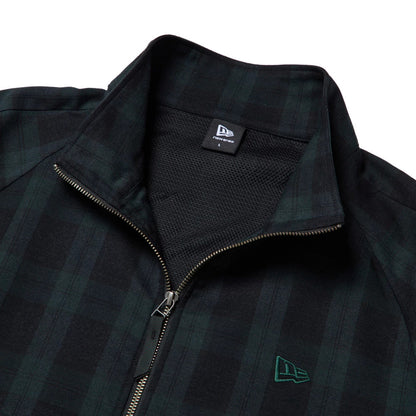 The model is wearing this New Era Blouson Plaid Windbreaker Jacket in Navy. 9