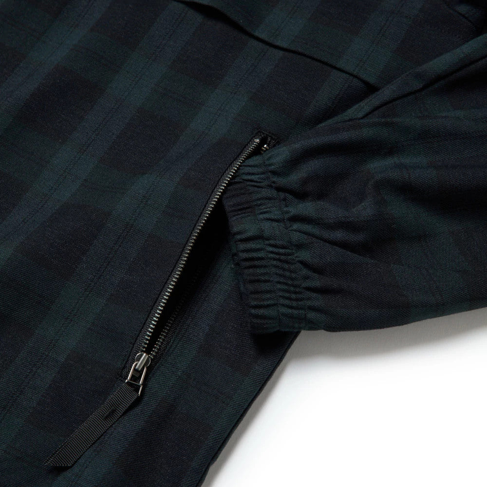The model is wearing this New Era Blouson Plaid Windbreaker Jacket in Navy. 13
