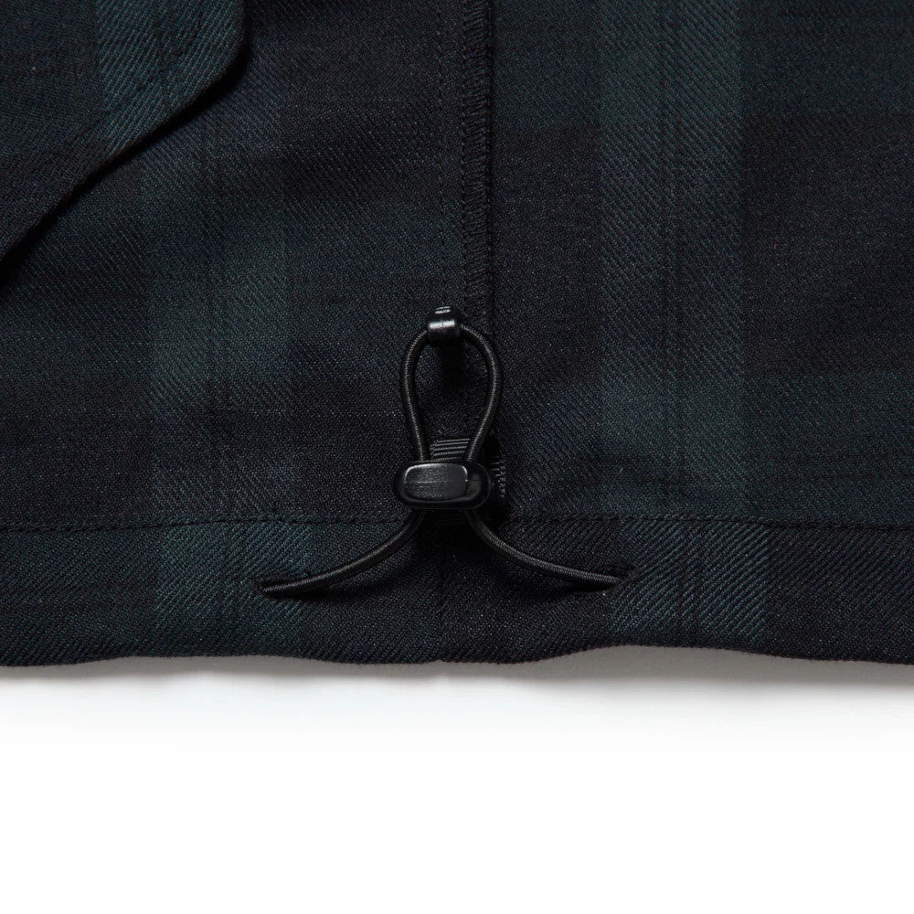 The model is wearing this New Era Blouson Plaid Windbreaker Jacket in Navy. 11