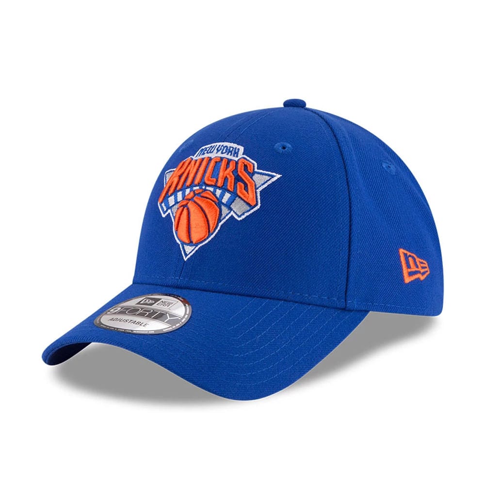 Pictured is this NBA Finals Champions 2026 New York Knicks 9FORTY cap in blue. 4
