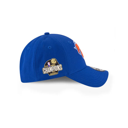 Pictured is this NBA Finals Champions 2026 New York Knicks 9FORTY cap in blue. 2