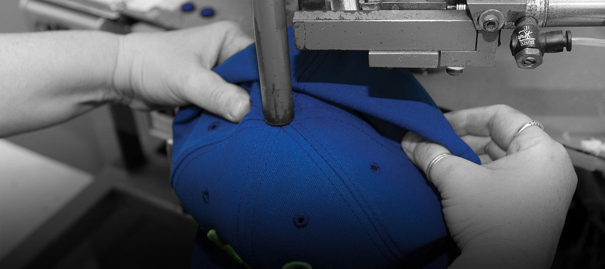step 19 from 22 steps to make a 5950 cap, where a button is applied to the top of the cap.