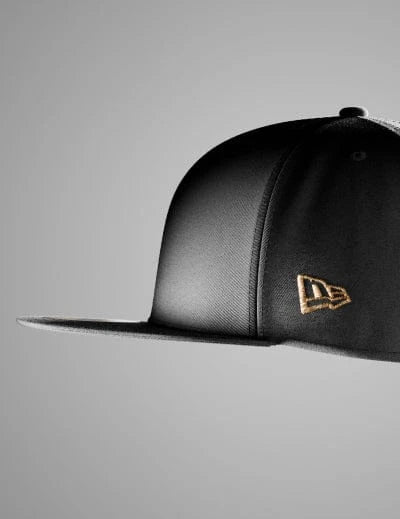 Grey 59fifty cap with gold New Era logo on a grey background
