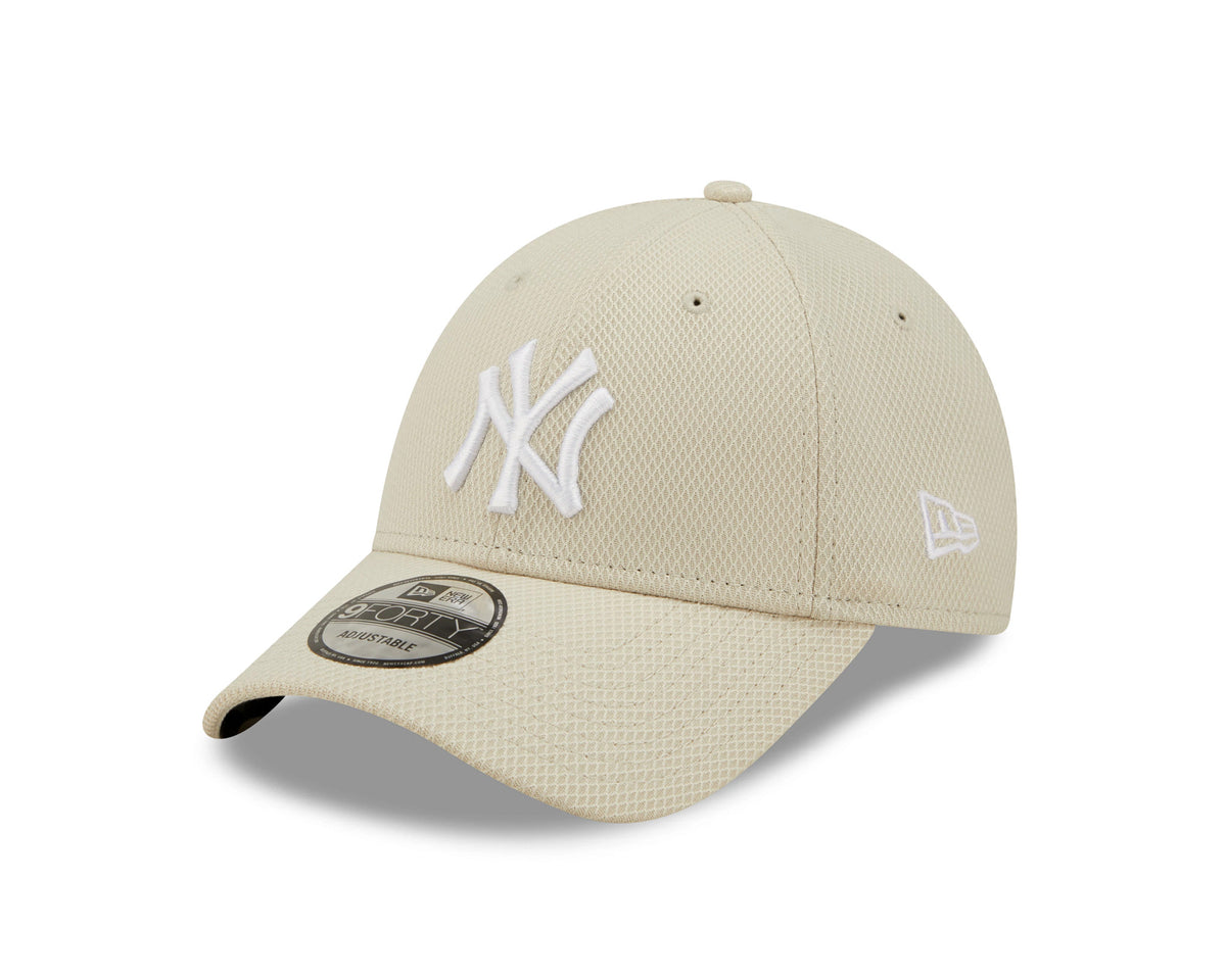 New York Yankees Diamond Era Stone New Era 9FORTY Cap, three-quarter view showing the raised white NY logo on the front panel, black and grey 9FORTY size sticker on the visor, and the New Era flag logo embroidered on the left side.