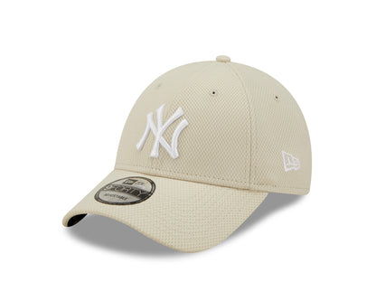 New York Yankees Diamond Era Stone New Era 9FORTY Cap, three-quarter view showing the raised white NY logo on the front panel, black and grey 9FORTY size sticker on the visor, and the New Era flag logo embroidered on the left side.