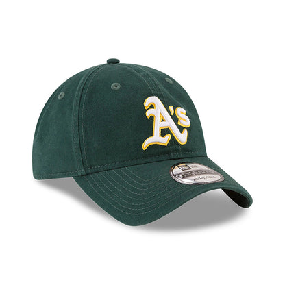 Athletics MLB Core Classic Dark Green New Era 9TWENTY Adjustable Cap, three-quarter view showing the raised white and yellow embroidered A's logo on the front panel, with a curved visor and a 9TWENTY size sticker on top.