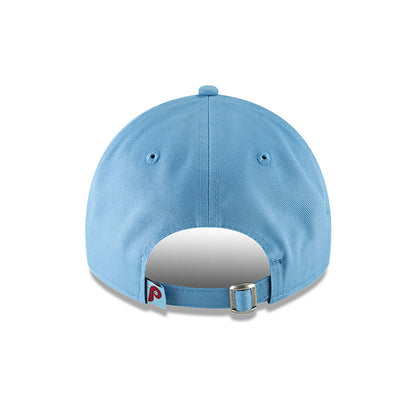Philadelphia Phillies MLB Core Classic Pastel Blue New Era 9TWENTY Adjustable Cap, rear view showing the red embroidered Phillies logo on a small tag next to the adjustable strap, centred below the pastel blue top button and eyelets.