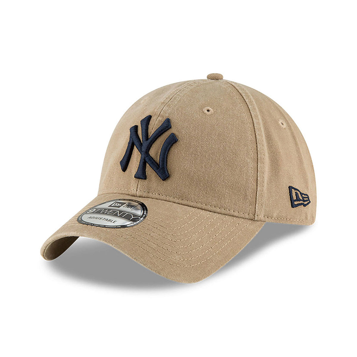 New York Yankees MLB Core Classic Beige New Era 9TWENTY Adjustable Cap, three-quarter view showing the navy raised embroidered NY logo on the front panel, with a 9TWENTY size sticker on the curved visor and the New Era flag logo on the left side.
