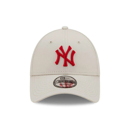 New York Yankees League Essential Stone New Era 9FORTY Cap, front view showing a raised red NY logo embroidered on the structured stone crown, with a 9FORTY size sticker on the curved visor and round top button.