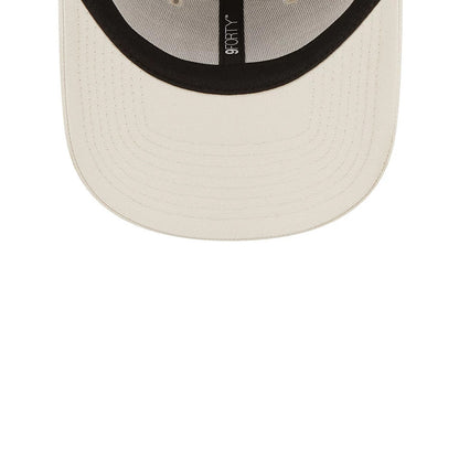 LA Dodgers League Essential Stone New Era 9FORTY Adjustable Cap, inside view showing black taping with a 9FORTY logo, a black sweatband lining the interior, and a light stone undervisor highlighting the cap's craftsmanship.