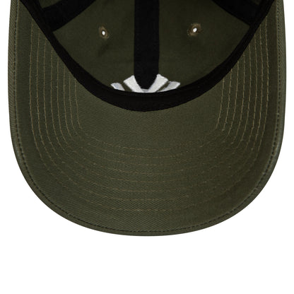 New York Yankees League Essential Green New Era 9TWENTY Adjustable Cap, inside view showing the white taping on the green undervisor and black sweatband, with the cap's inner stitching and eyelet details.
