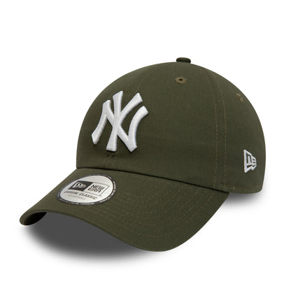 New York Yankees League Essential Green New Era 9TWENTY Adjustable Cap, front view showing the raised white NY logo on the front panel, curved visor with a 9TWENTY size sticker, and New Era flag logo on the left side of the green crown.