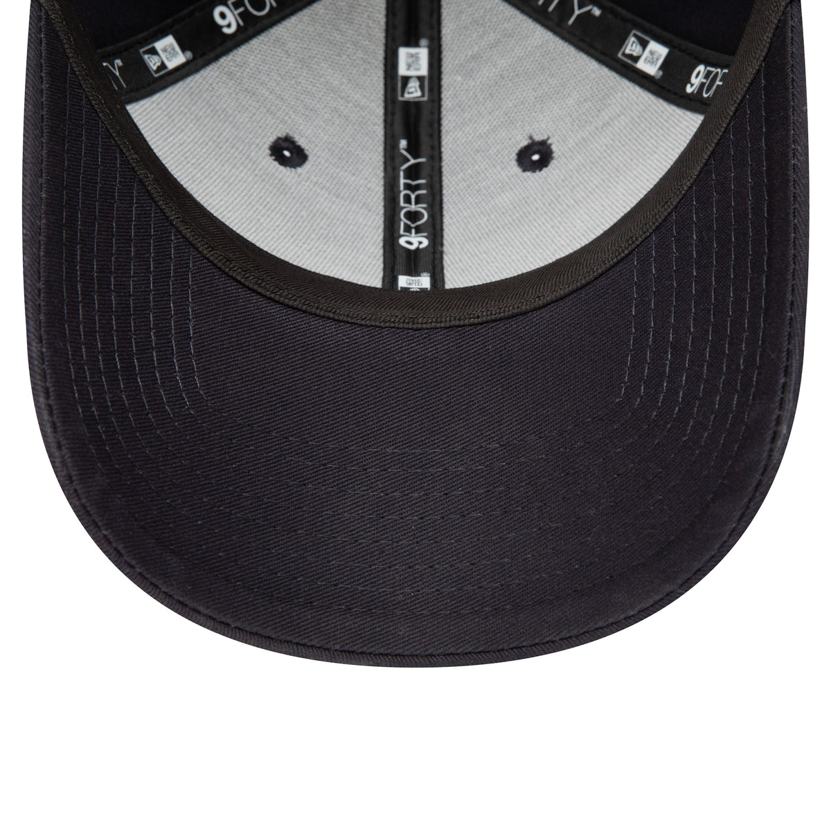 Red Bull Essential Navy New Era 9FORTY Adjustable Cap, inside view showing 9FORTY taping along the seams, a black sweatband, and grey undervisor with navy stitching, highlighting the structured design and attention to detail.