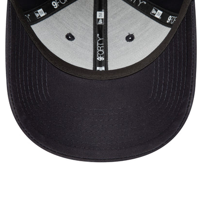Red Bull Essential Navy New Era 9FORTY Adjustable Cap, inside view showing 9FORTY taping along the seams, a black sweatband, and grey undervisor with navy stitching, highlighting the structured design and attention to detail.